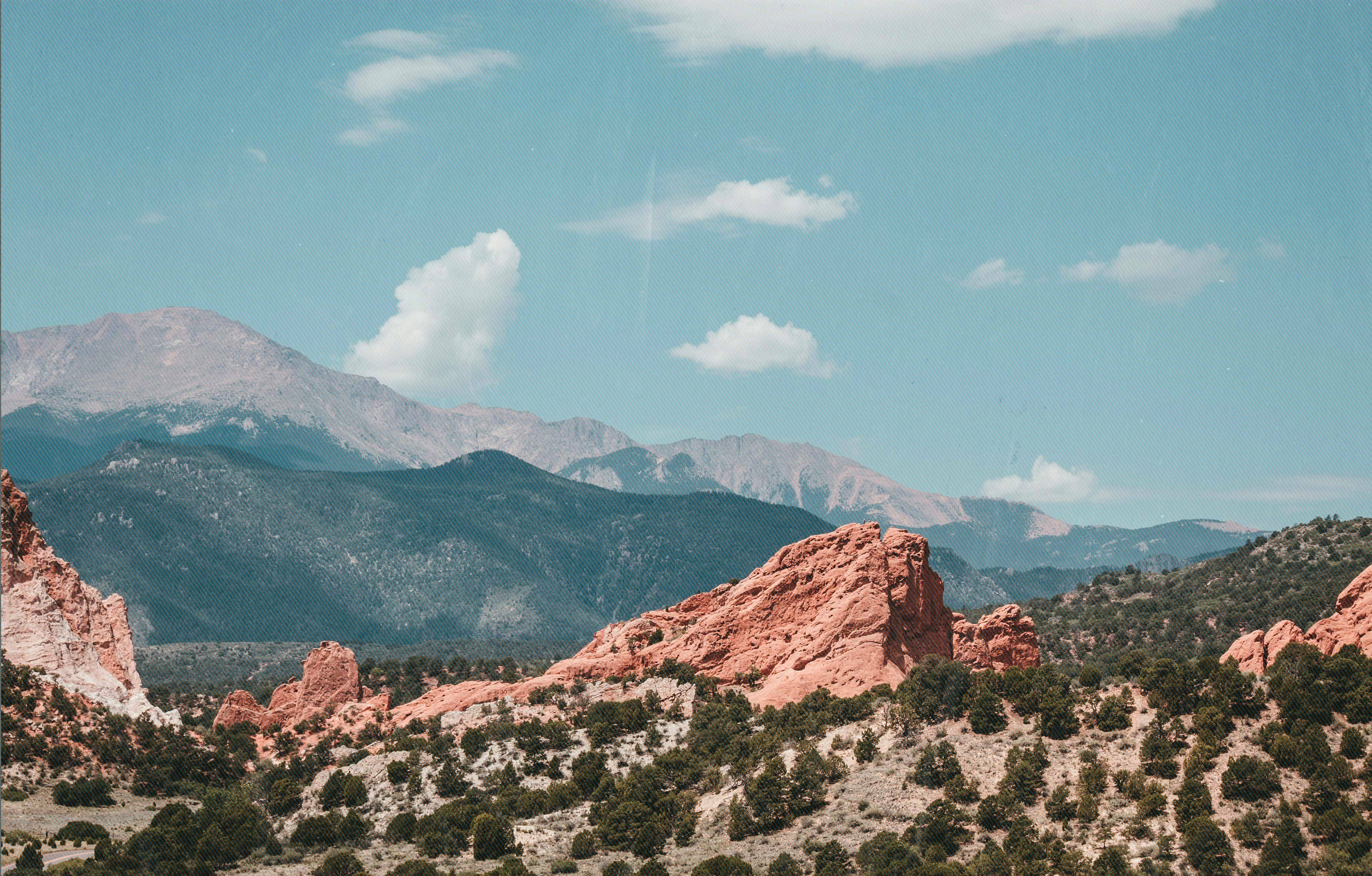Garden of the Gods rock formations at sunset with mountain views