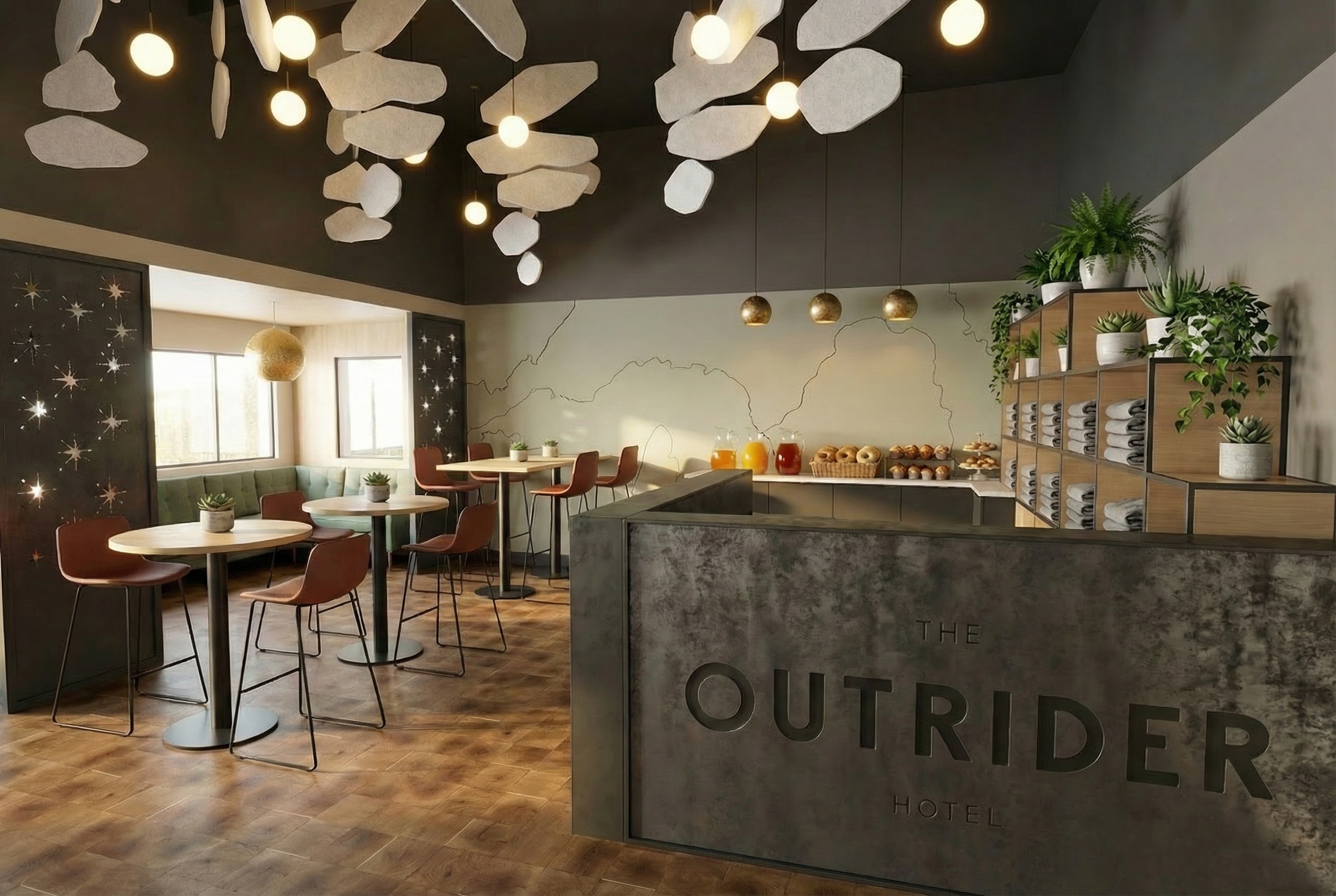 The Outrider Hotel lobby with sculptural ceiling art, breakfast bar, and modern mountain decor in Manitou Springs Colorado