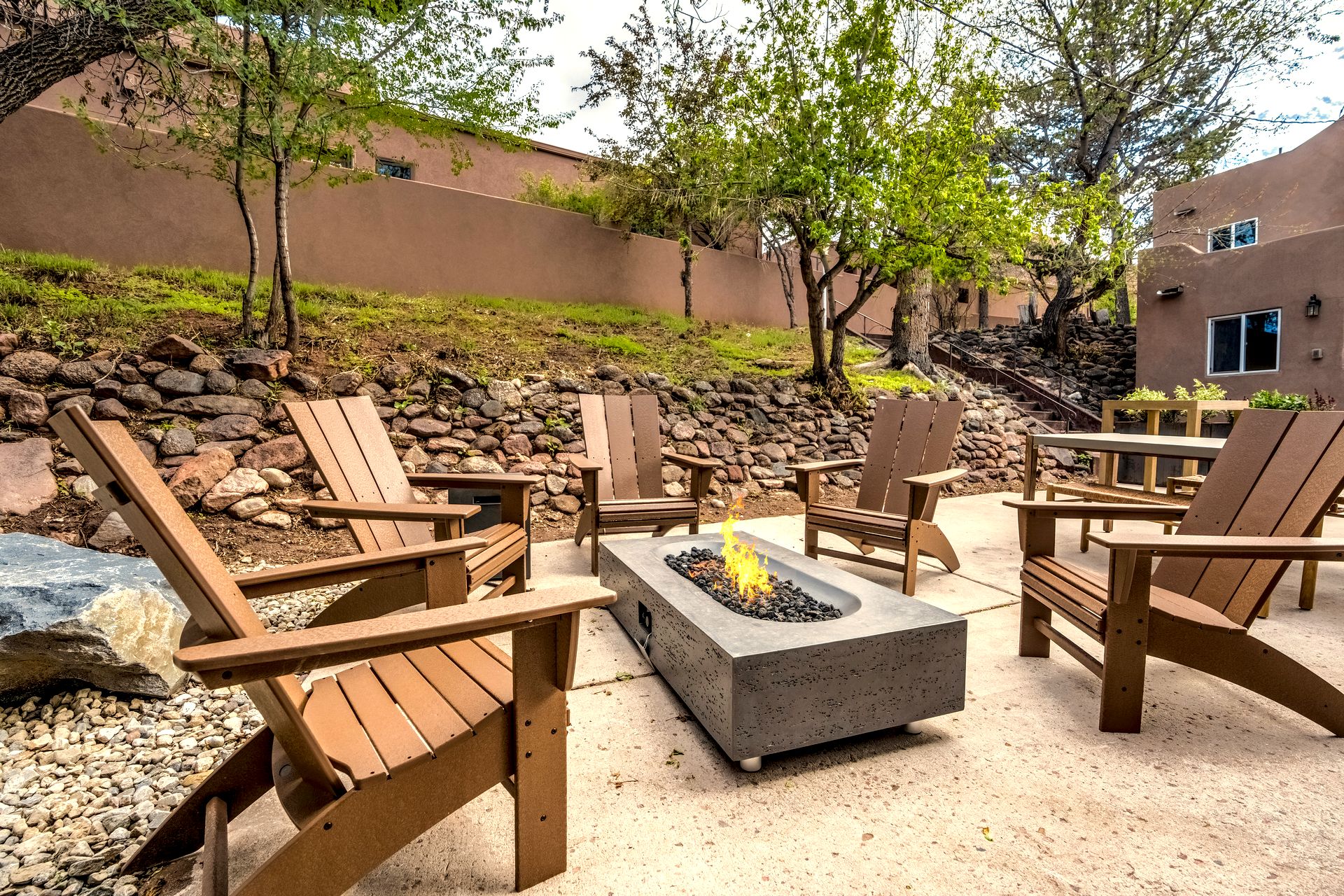 Fire pit with Adirondack chairs at The Outrider Hotel in Manitou Springs