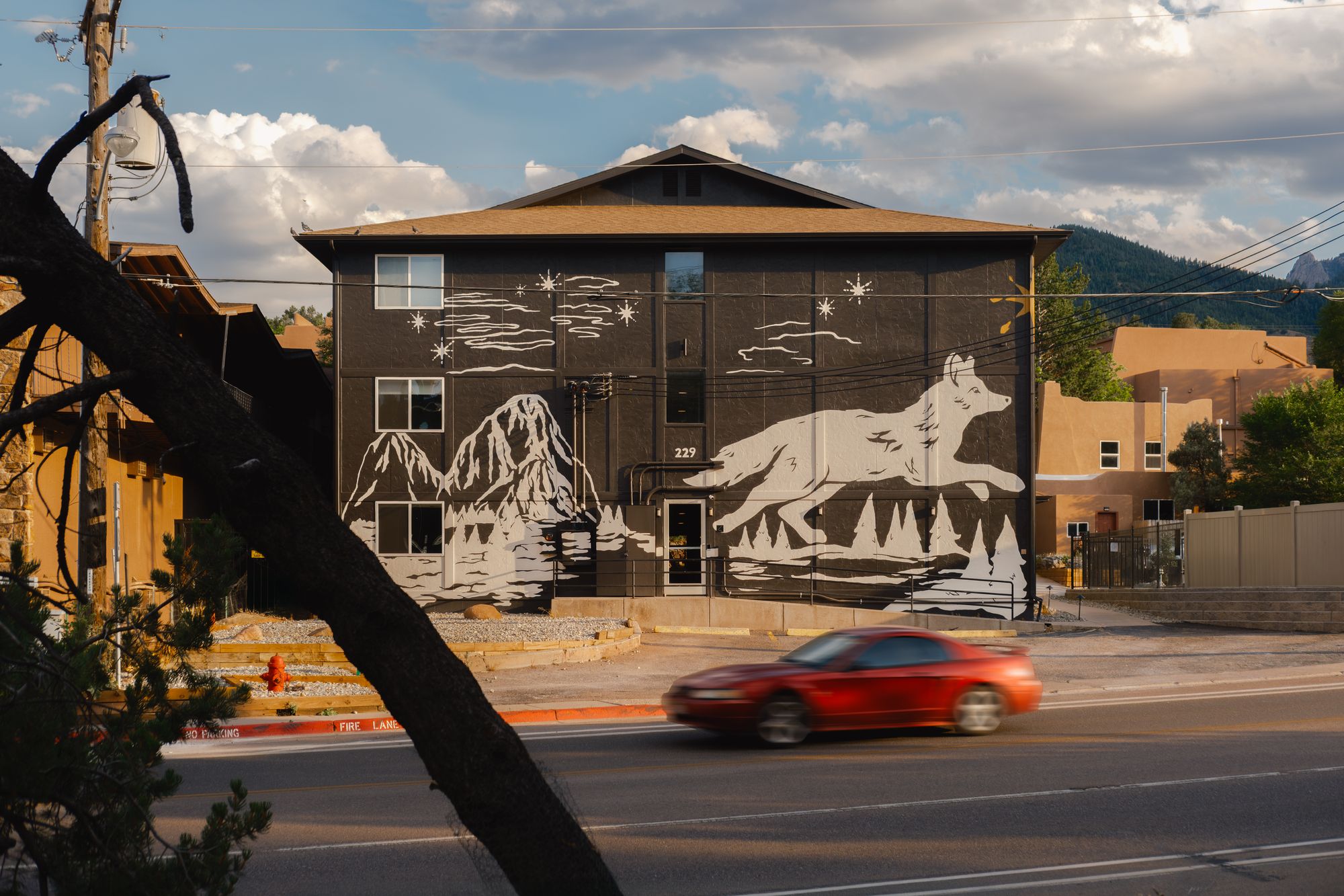 The Outrider Hotel's wolf mural facing Manitou Avenue in Manitou Springs, Colorado