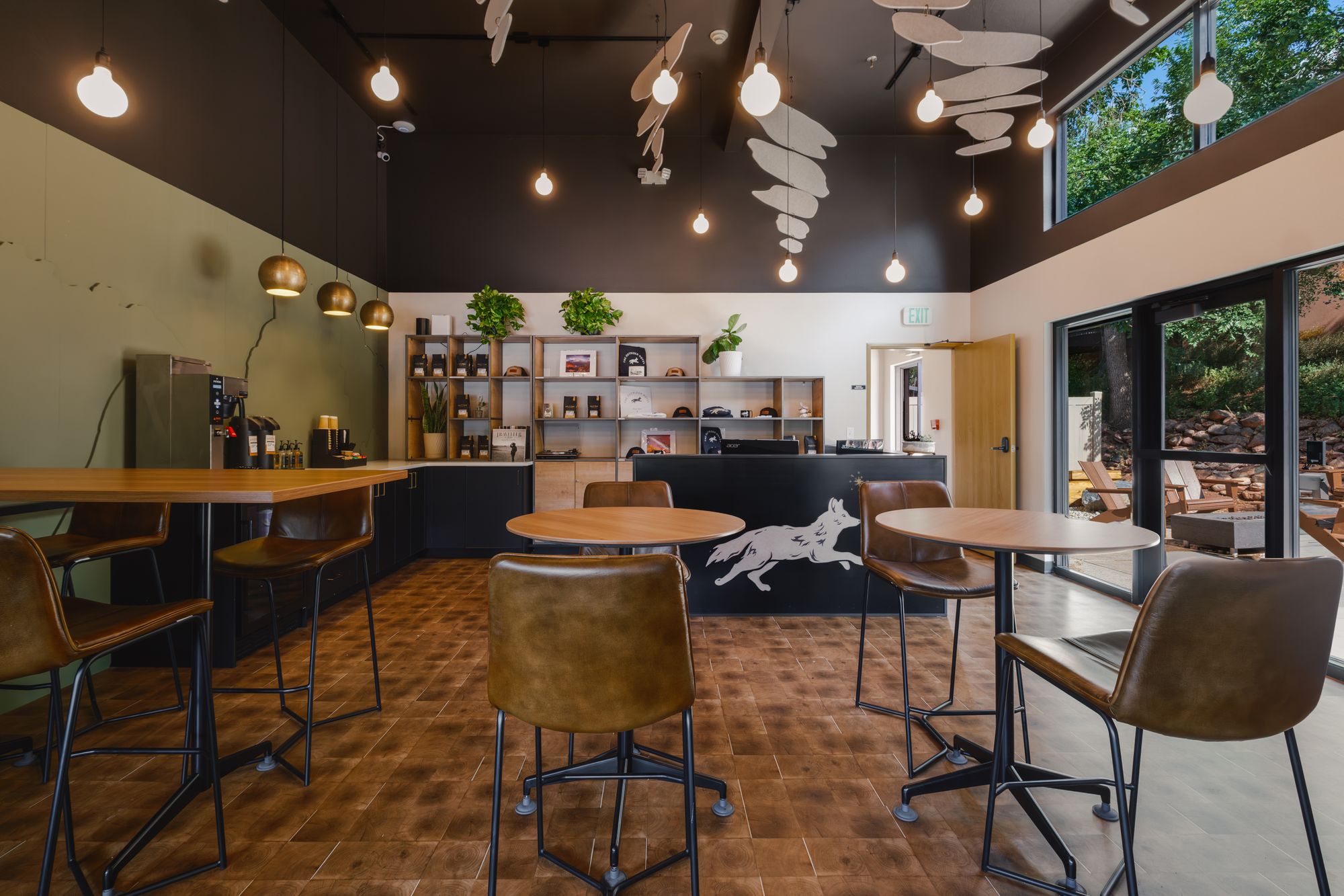 Café seating with leather chairs and walnut tables in The Outrider Hotel lobby in Manitou Springs