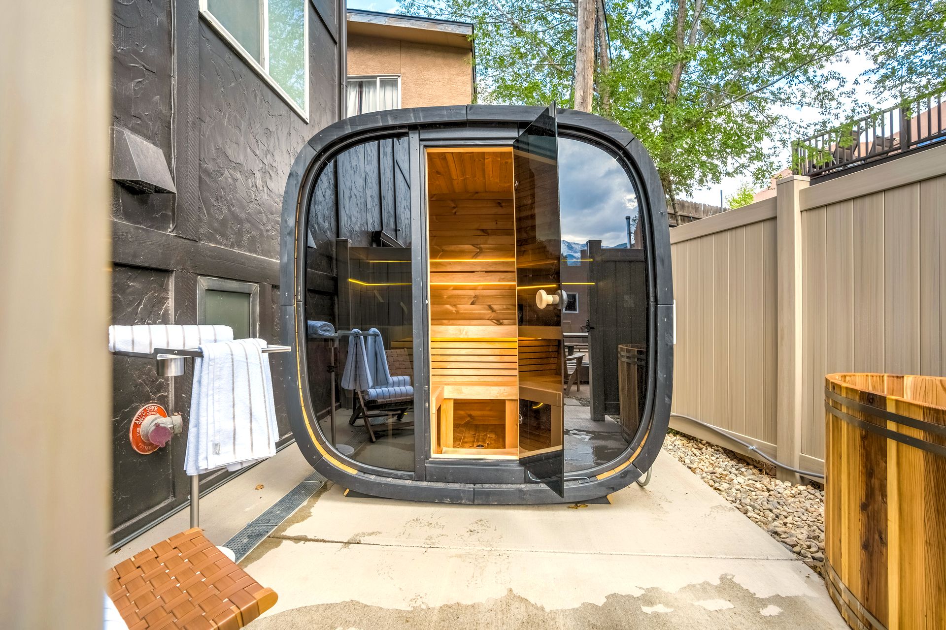 Modern outdoor sauna with glass front at The Outrider Hotel in Manitou Springs